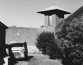 The Prison van and a corner watch tower